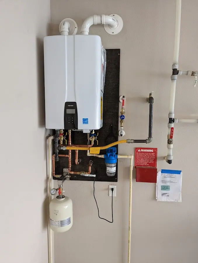 Professional plumber installing copper piping in a Williamsport home